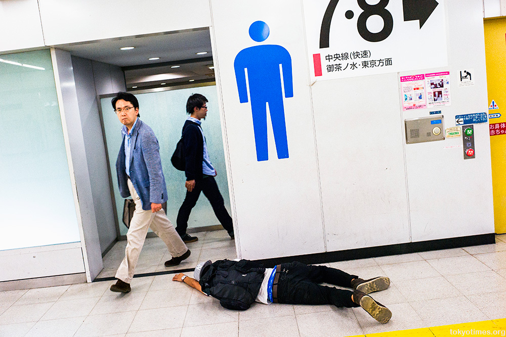 drunk Japanese man man passed out in Tokyo