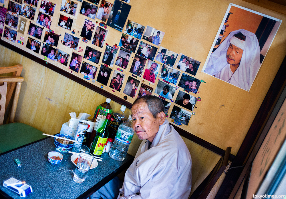 Japanese old man in a tiny bar