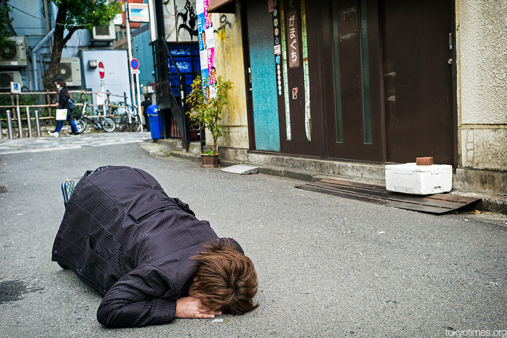 drunk and asleep in Tokyo