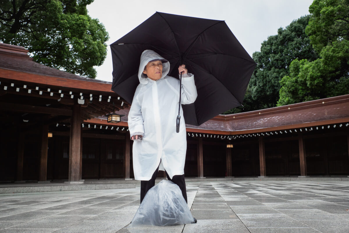 A Japanese man in a typhoon at Tokyo's Meiji Shrine