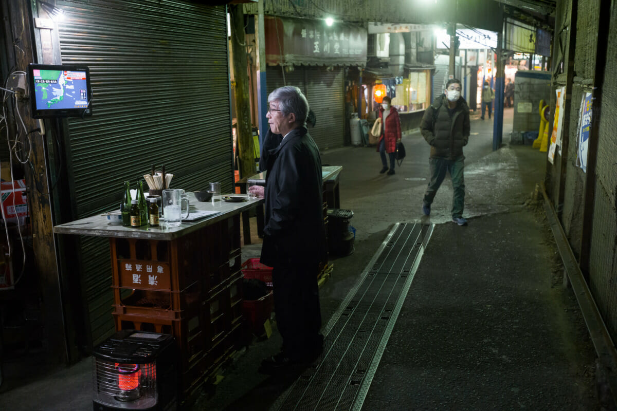 a dystopian Japanese drinking alleyway