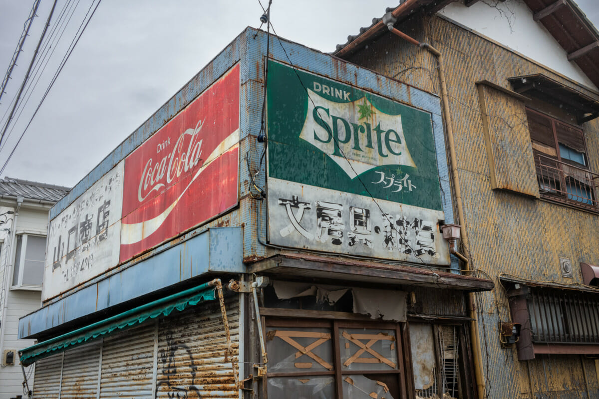 faded Tokyo Coca-Cola and Sprite signs