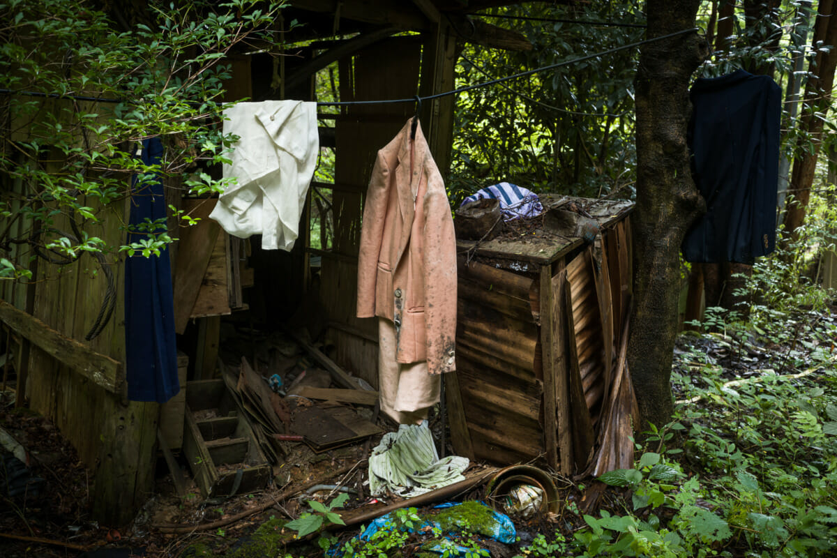 discarded clothes outside an abandoned Japanese home