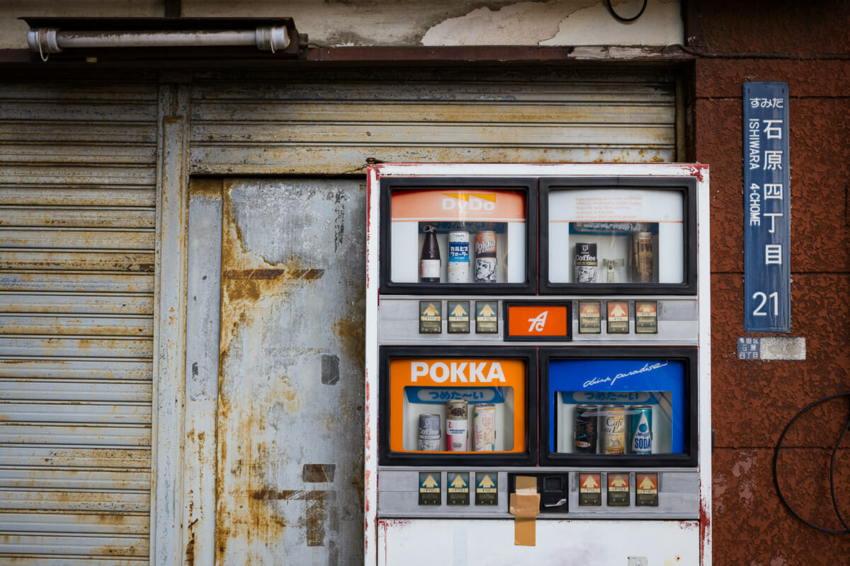An old, broken and unique old Japanese vending machine