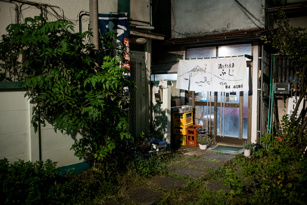 an old cluttered and interesting little Tokyo bar