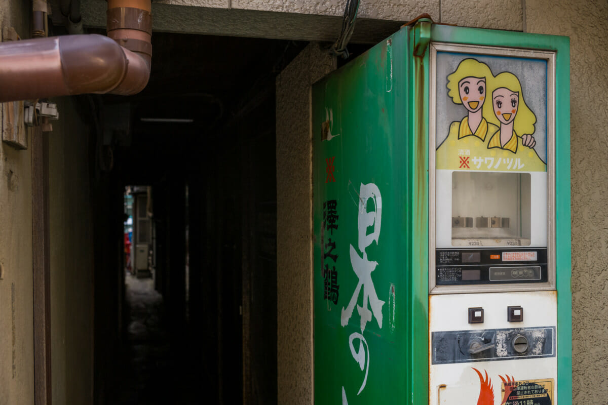 The rust and broken vending machines of an old Tokyo liquor store