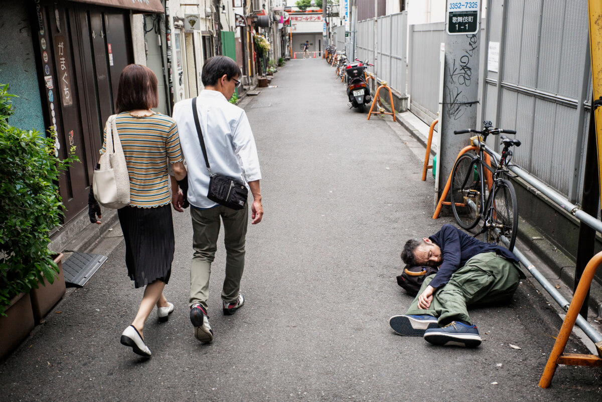 A Japanese man drunk and asleep in Tokyo