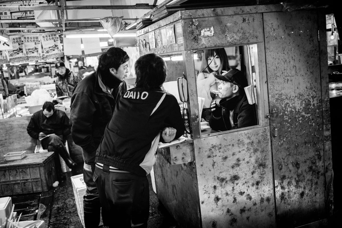 tsukiji fish market men and a woman